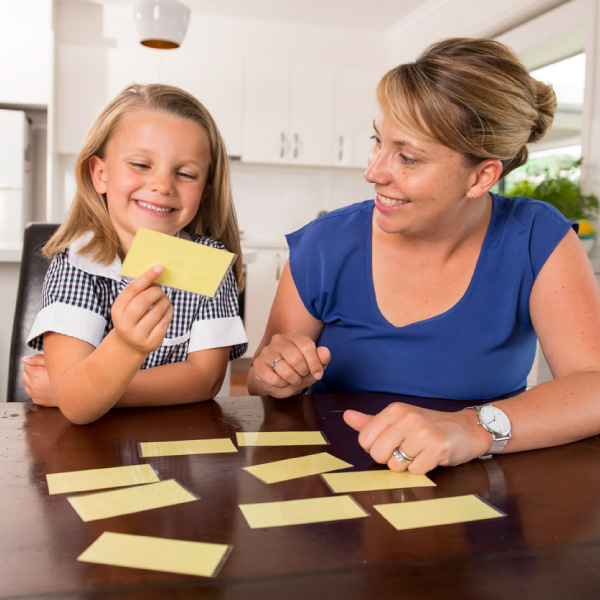 Mother and girl playing with memory cards