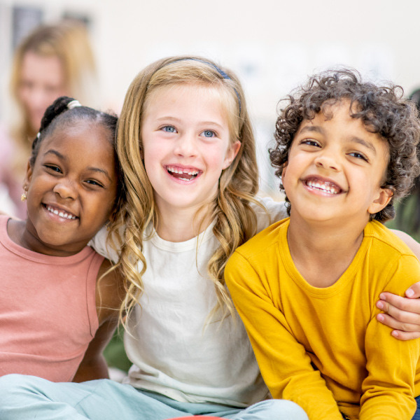 Three kids smiling