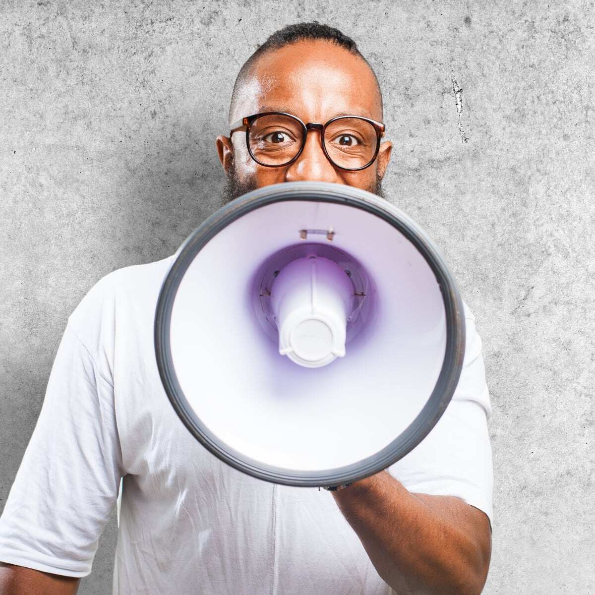 Man speaking into megaphone. 