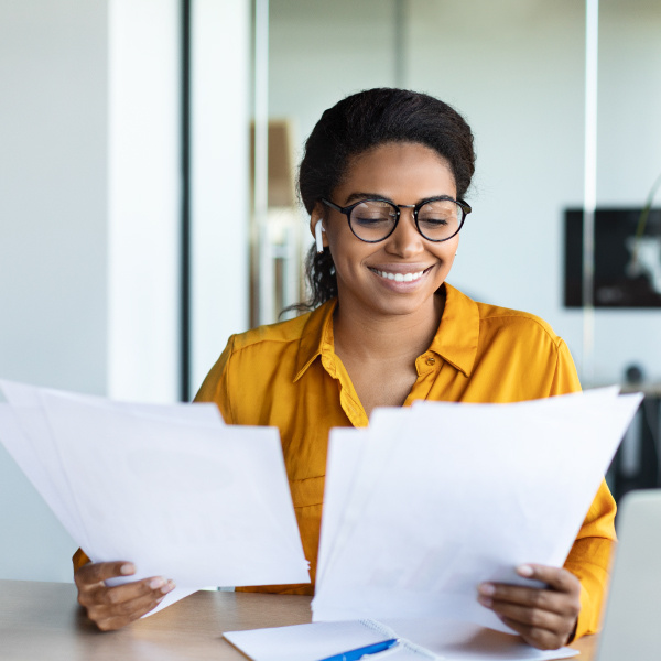 Smiling woman looking at documents