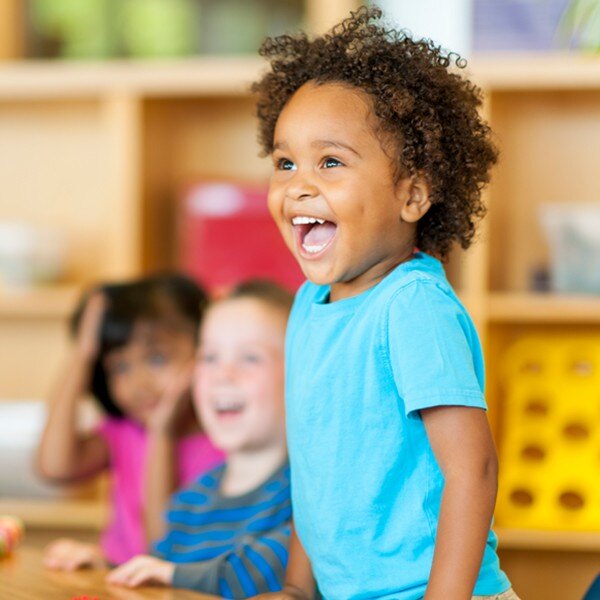 young children in classroom laughing