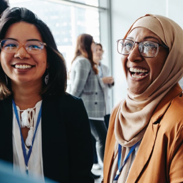 Two teachers laughing