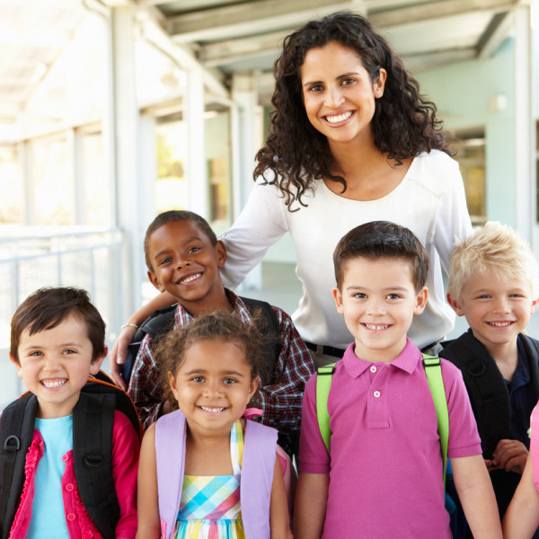 Teacher with six young students