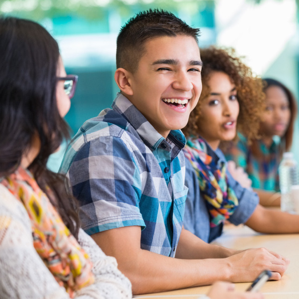 diverse students in classroom smiling