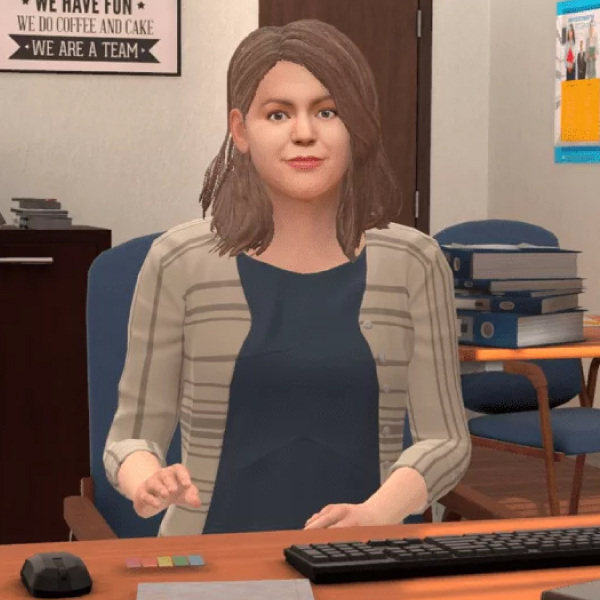 woman sitting at desk in office facing forward