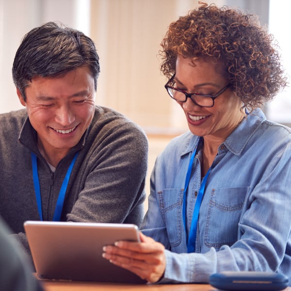 Man and woman looking at tablet