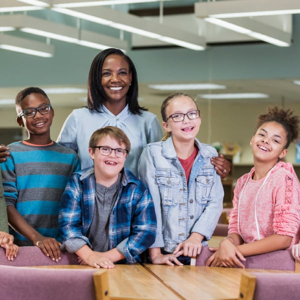 Teacher standing with students