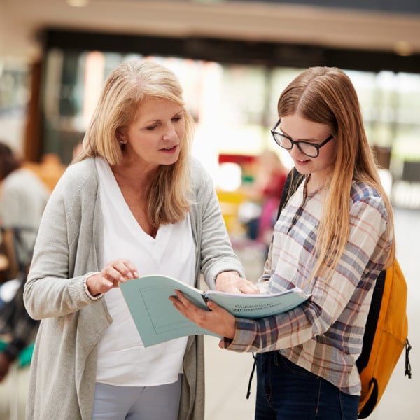 Teachers talking to students